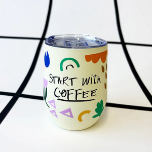 Cream-coloured thermal travel mug with “Start with Coffee” text, colourful abstract design and clear lid.