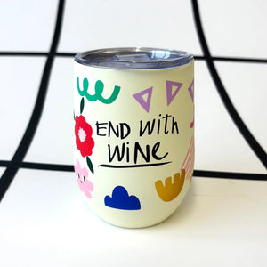 Opposite side of the travel mug with “End with Wine” text and colourful floral and geometric pattern.