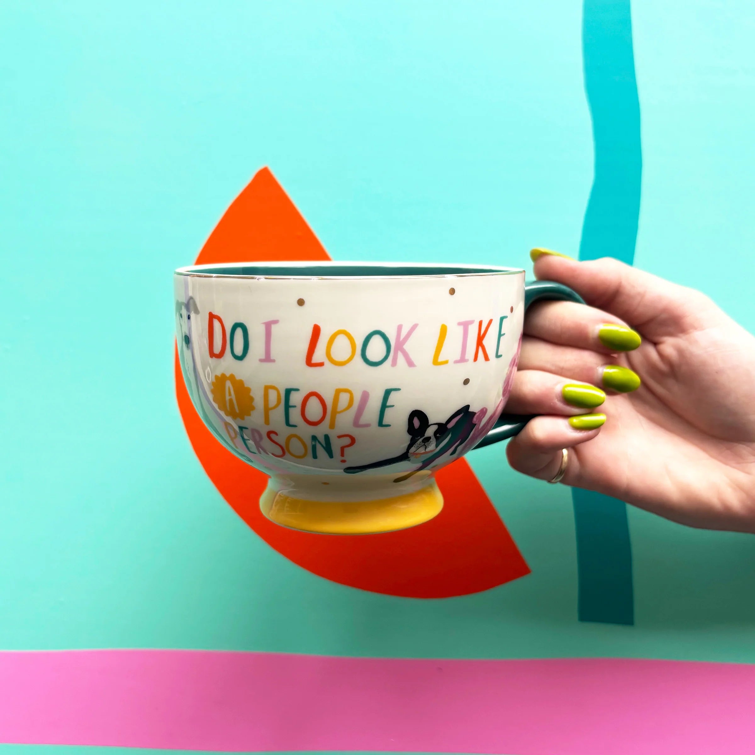 Hand holding the Do I Look Like a People Person mug with playful dog print.