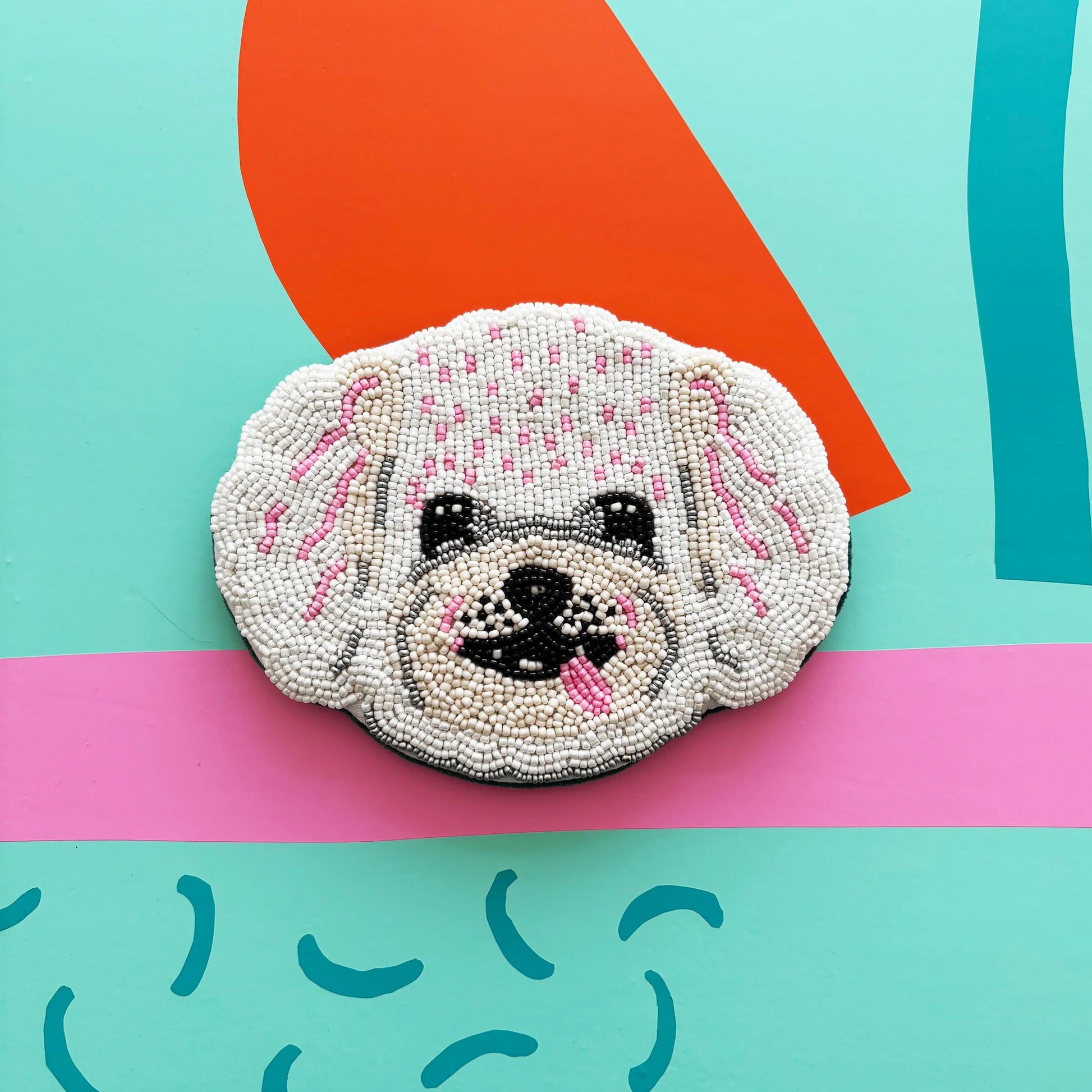 Beaded Dog House Coin Purse on colourful background – front view with playful dog design.