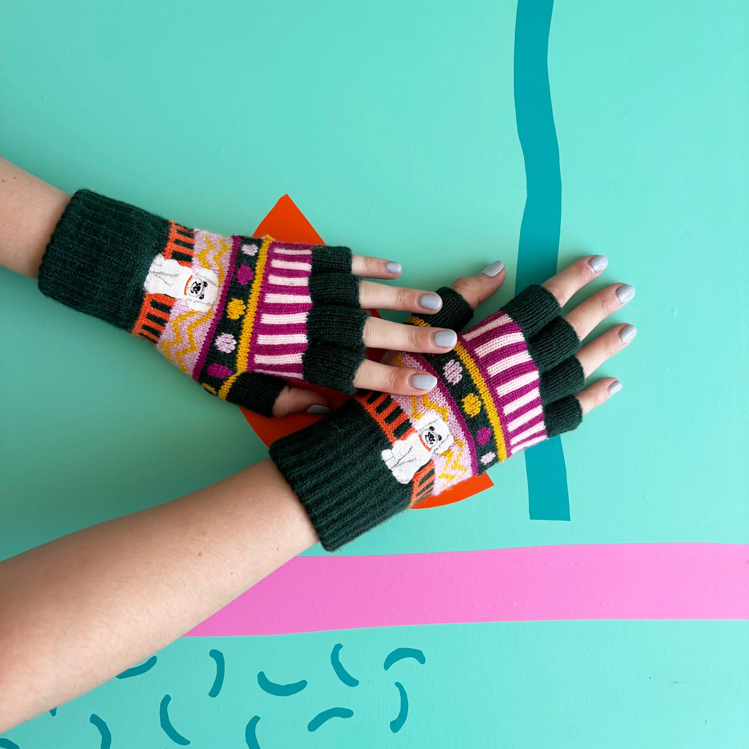 Model wearing Dog House Fair Isle Fingerless Gloves with playful multicolour knit design.