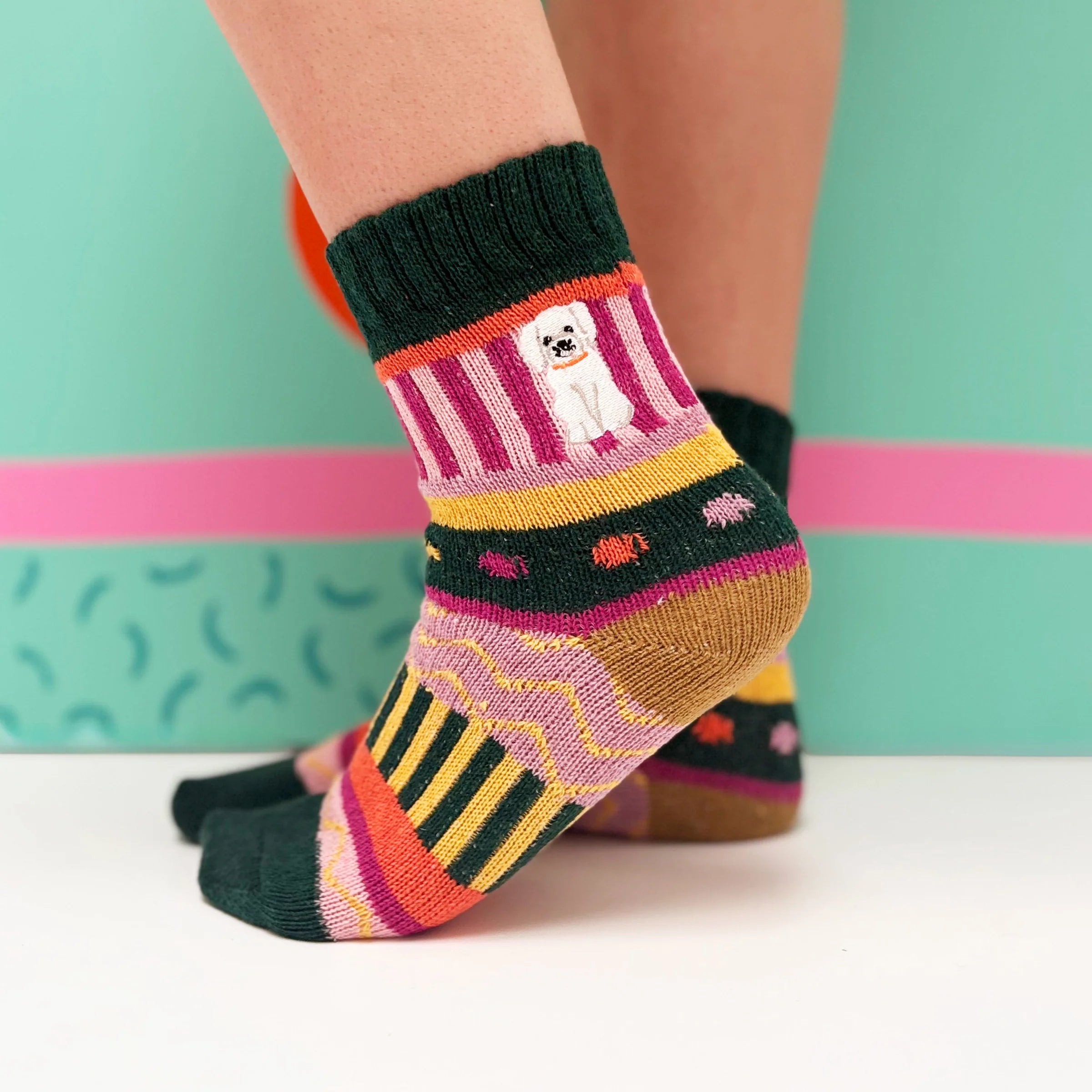 Model standing in patterned socks with colourful Fair Isle design.