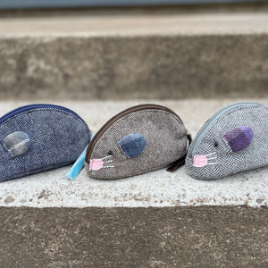 A collection of Earth Squared Juniper Mouse Purses in different colours, showcasing their playful design and functional features.