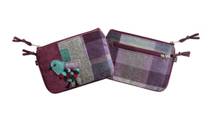 Close-up view of the Earth Squared Tweed Applique Juliet Purse with bird design, highlighting its two zipped compartments and soft texture in greys and plum.