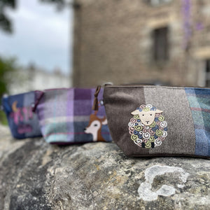 Earth Squared Tweed Applique Makeup Bags: A collection of Makeup Bags featuring Highland Cow, Deer, and Sheep appliqués, showcasing their diversity and style.