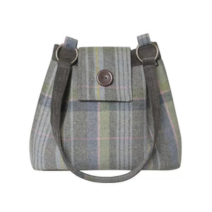 Earth Squared Tweed Ava Bag in Luffness tweed( Green, pink and grey), highlighting its classic silhouette and secure foldover flap with magnetic closure. Sustainable style on-the-go.