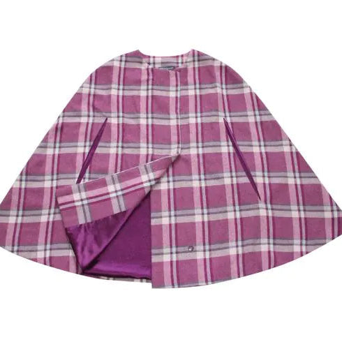 Flat lay of Earth Squared Winton Tweed Cape showing front and plum satin lining.