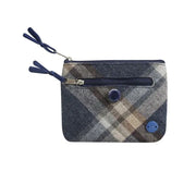 Plaid patterned pouch with blue accents on a white background.