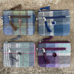 A collection of Earth Squared Tweed Emily Purses in various colours, demonstrating their versatility and style.