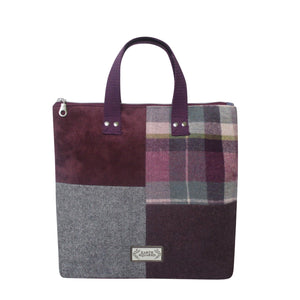 Earth Squared Tweed Lois Patchwork Backpack in Aberlady tweed ( plum & grey) highlighting its unique patchwork design and convenient top grab handle.