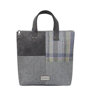 Earth Squared Tweed Lois Patchwork Backpack in Luffness tweed (green, blue & grey) highlighting its unique patchwork design and convenient top grab handle.