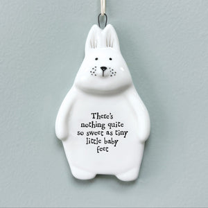 Porcelain New Baby Rabbit Hanging Plaque with the quote “There’s nothing quite so sweet as tiny little baby feet,” featuring a minimalist rabbit design and string hanger.