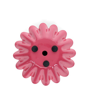 Base view of vibrant pink enamel candle holder showing three black foam pads and central candle hole.