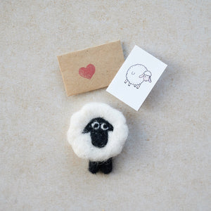 Close-up of the tiny wool felt sheep with a miniature card and heart-stamped envelope.