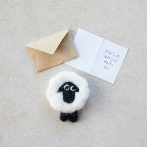 Miniature greeting card with “Ewe’s all soft and fluffy” message beside the felt sheep.