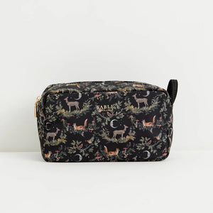 Front view of the Fable England A Night’s Tale Woodland Pouch in black with woodland animal print and gold-tone branding.