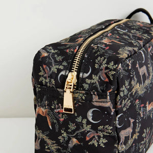 Close-up of the gold-tone zip closure on the Fable England Woodland Pouch, highlighting the intricate animal print.