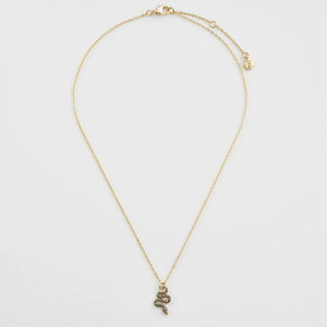 Full-length image of the necklace laid flat, showing the delicate gold chain and celestial snake charm.