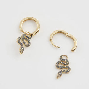 Image of snake earrings with detachable charms, highlighting the two ways to wear them.