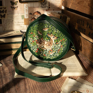 Lifestyle View: The Chloe Fawn Circle Bag placed in a rustic setting, highlighting its intricate embroidery.