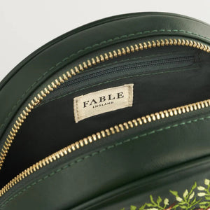 Interior View: Inside of the Chloe Fawn Circle Bag, featuring a lined compartment with a secure zip.