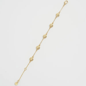 Reverse side of the bracelet revealing gold-plated backing and clasp design.