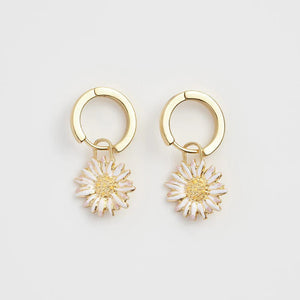 Front View: Fable England Daisy Huggie Earrings – Gold-plated hoops with daisy enamel detail.