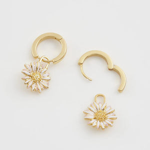 Side View: Lightweight and elegant daisy hoop earrings in gold-plated brass.