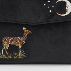 Close-up of Embroidery: A detailed shot of the embroidered deer and crescent moon, highlighting the intricate stitching and rich texture.