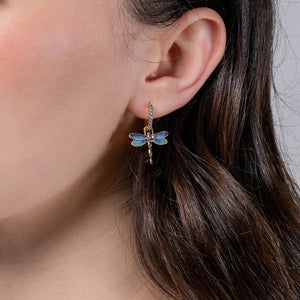 A model wearing the earrings, showing how they elegantly dangle from the earlobe.
