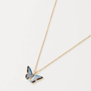 A delicate gold chain necklace featuring a hand-painted enamel blue butterfly pendant, displayed against a white background.