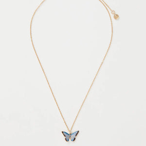 A full view of the Fable England Enamel Blue Butterfly Short Necklace with an adjustable gold chain and lobster clasp.