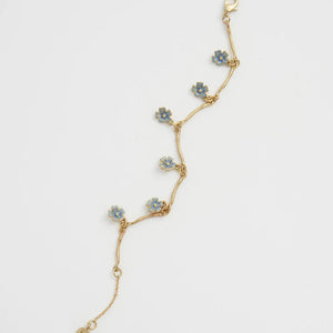 Flat lay image of the Forget Me Not Bracelet fully extended, highlighting the delicate branch-inspired design.
	