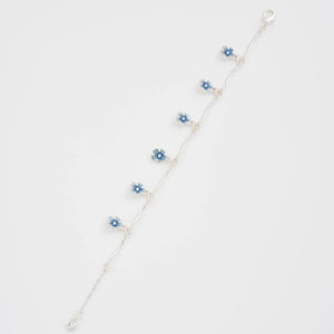 Silver Fable England bracelet with floral charm shown in gift box.