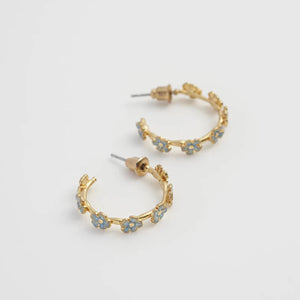 Side angle of the Forget-Me-Not Stud Hoop Earrings, showcasing the delicate twig-inspired gold-plated hoop and floral details.