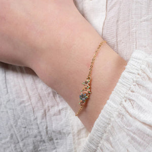 A model wearing the Hibiscus Bracelet, demonstrating its delicate fit on the wrist.