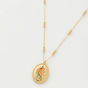 Front view of the Fable England Leo Zodiac Necklace featuring a gold-plated pendant with a hand-painted lion design on a celestial-inspired beaded chain.