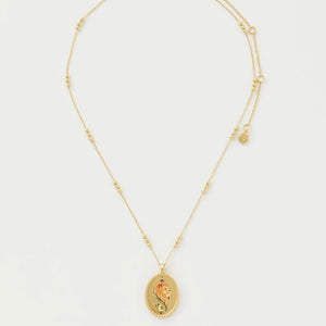 Full-length view of the Fable England Leo Zodiac Necklace, showcasing the delicate gold chain with celestial engravings and an adjustable extender.