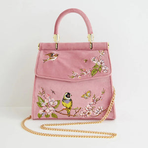 Mini Pink Tote with a detachable gold chain strap, combining elegance with practicality for a versatile carrying option.