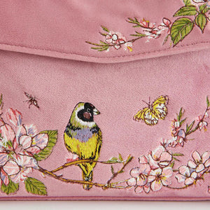 Close-up of the embroidery on the Fable England Mini Pink Tote, featuring a goldfinch, cherry blossoms, and butterflies in exquisite detail.