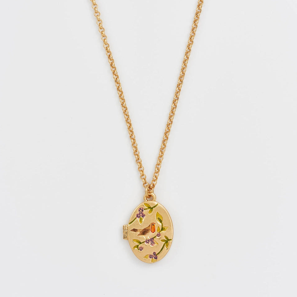 Close-up of Robin & Blackberry Gold Oval Locket Necklace on gold chain with enamel bird and berry design.