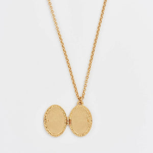 Open Robin & Blackberry Gold Oval Locket Necklace showing inside space for photo or keepsake.