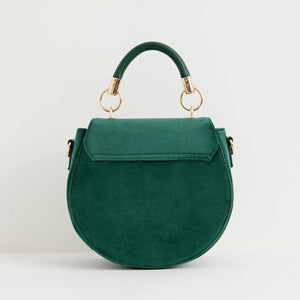 Back of eco-friendly fern green velvet saddle bag with smooth finish and gold hardware.