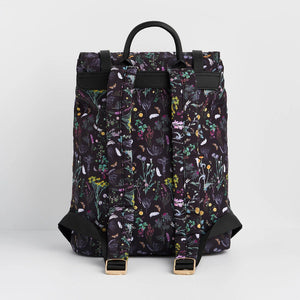 Back view of Wilderness Buckle Backpack showing adjustable padded straps and full floral fabric design on black background.