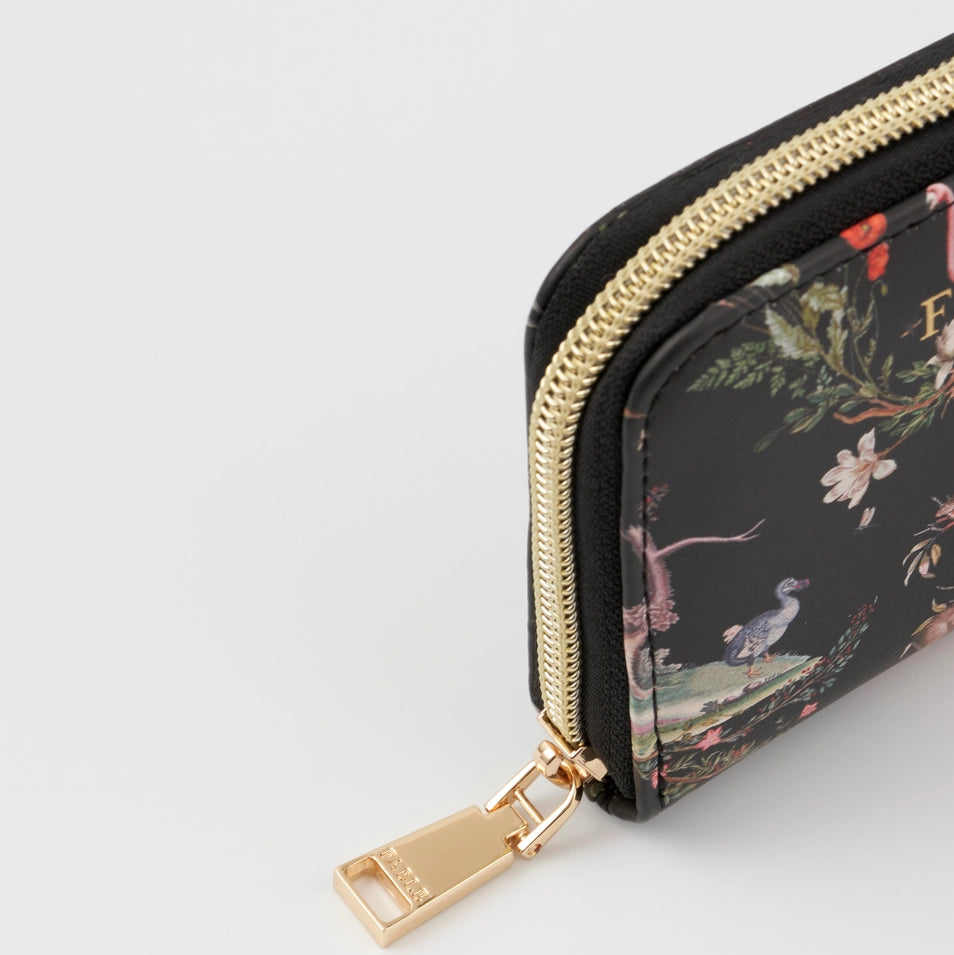Close-up of gold zip pull on Wonderland Black Small Wallet by Fable England.