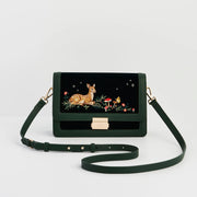 Fawn Embroidered Green Crossbody Bag with gold clasp and woodland fawn design on dark green velvet front panel.