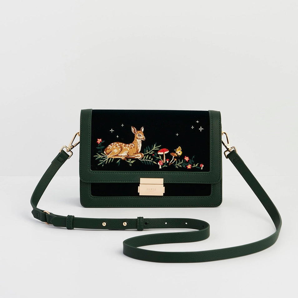 Fawn Embroidered Green Crossbody Bag with gold clasp and woodland fawn design on dark green velvet front panel.