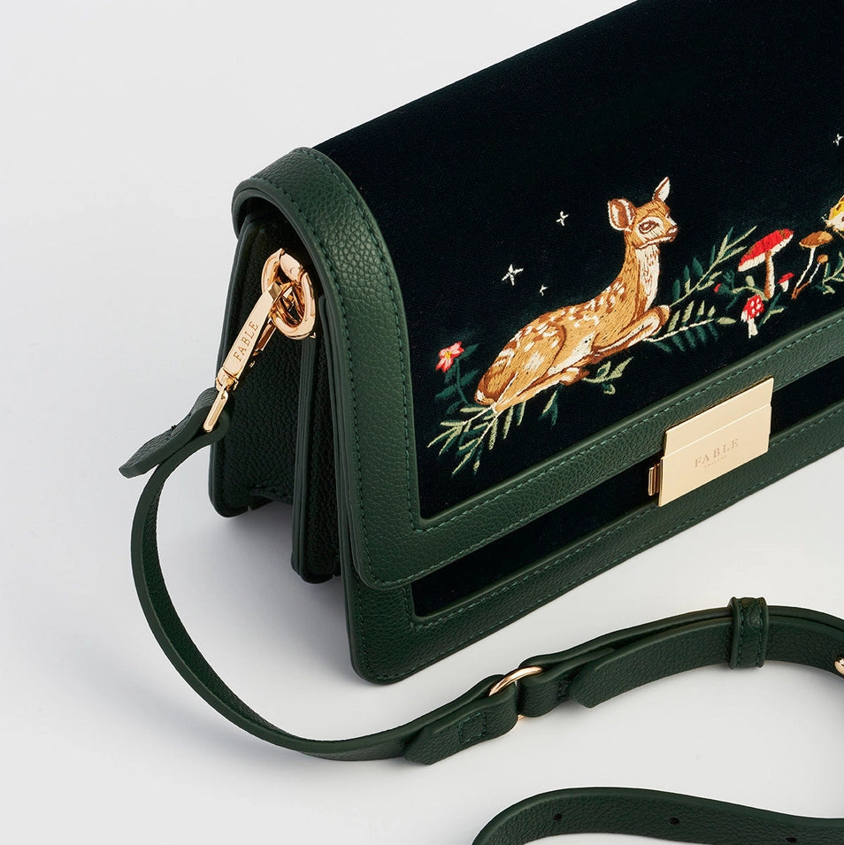 Close-up of Fawn Embroidered Green Crossbody Bag side profile with gold hardware and detachable strap.