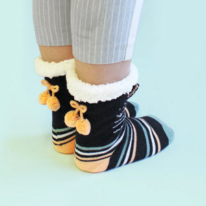 Back view of Feline Slipper Socks with orange pom poms and cuffed fleece lining.