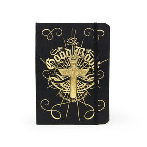 Front cover of the disguised hip flask book featuring gold foil typography and cross design with the words “The Good Book”.